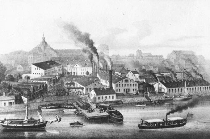 Industriellt stadslandskap i svart och vitt.
