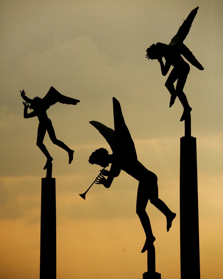 Statues of Milles at sunset