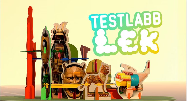 Leksaker, andra föremål och texten "Testlabb: LEK".