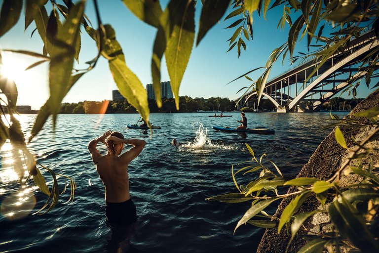 Friends swimming in Stockholm