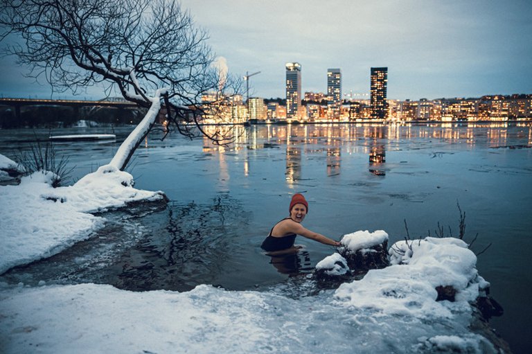 A woman talking a winter bath, late afternoon in Stockholm, Södermalm