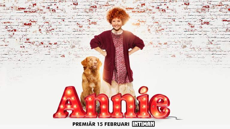 En flicka och en hund från musikalen Annie.
