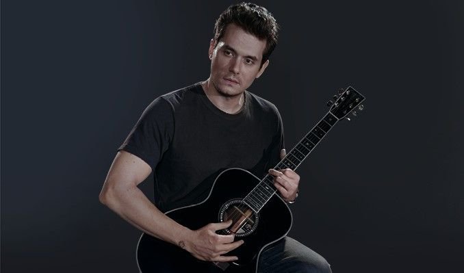 Musikern med sin gitarr.
